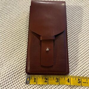 HANDMADE leather cell phone holder. See pictures for measurements.  Never used.